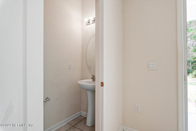 bathroom featuring tile patterned flooring and sink