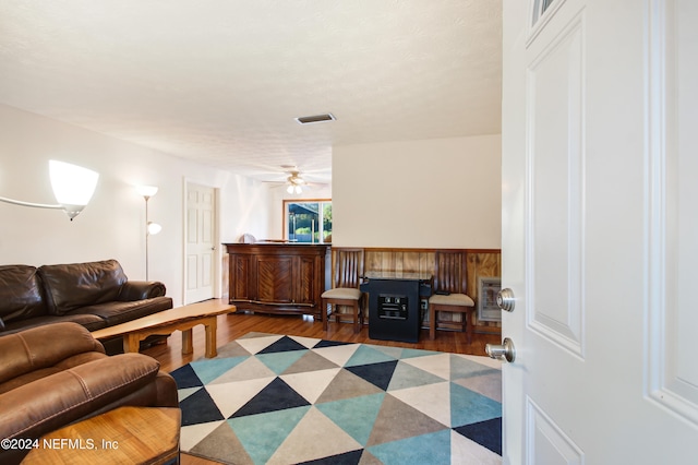 living room with hardwood / wood-style flooring and ceiling fan