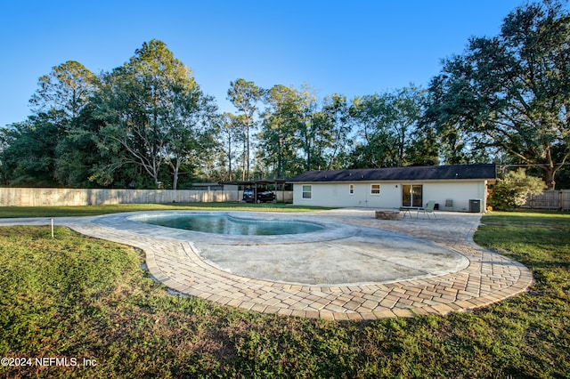 view of pool featuring a lawn and a patio area