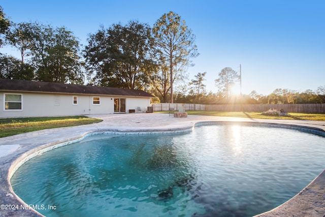 view of swimming pool featuring a patio area