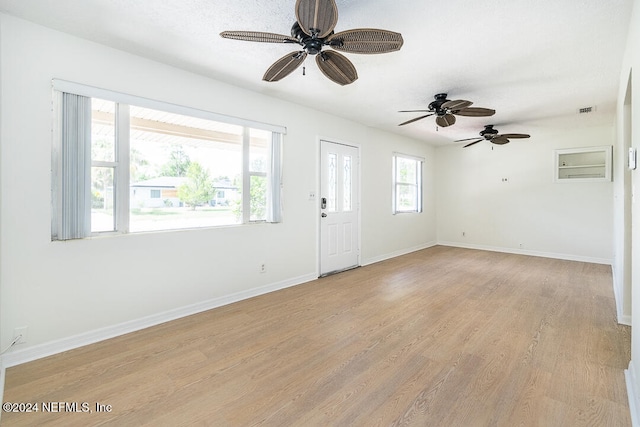 interior space featuring ceiling fan and light wood-type flooring