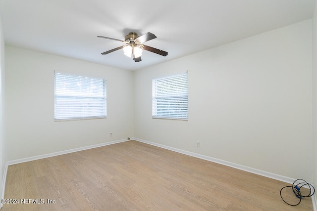 unfurnished room with ceiling fan, light hardwood / wood-style flooring, and a healthy amount of sunlight