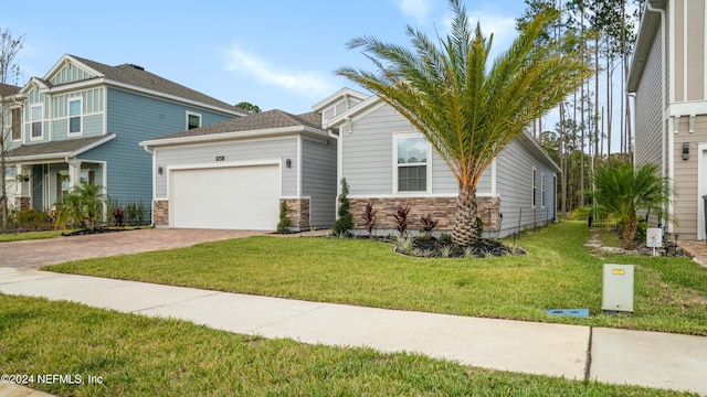 view of front of house featuring a garage and a front yard