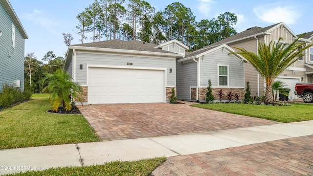 view of front facade with a garage and a front yard