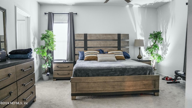 carpeted bedroom with ceiling fan