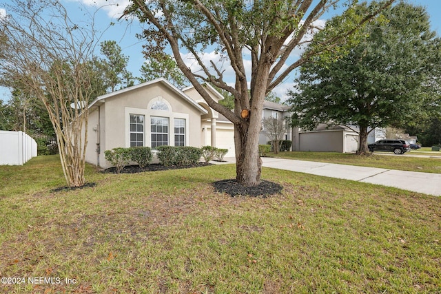 ranch-style home with a front lawn