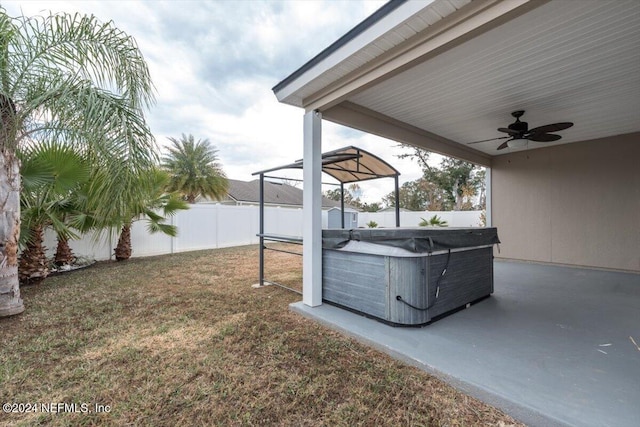 view of yard featuring a patio and ceiling fan