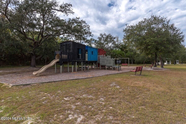 view of playground featuring a lawn