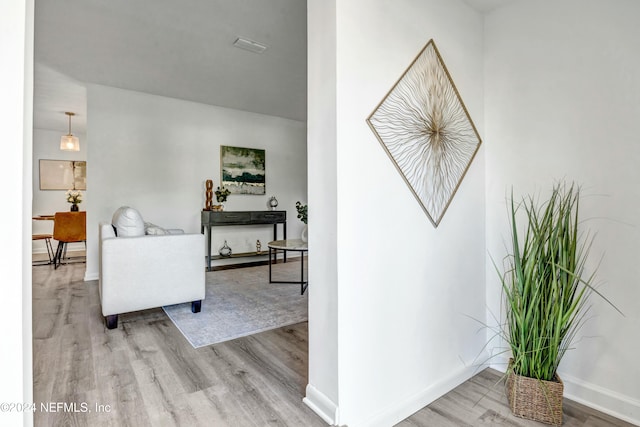 hall with light wood-type flooring