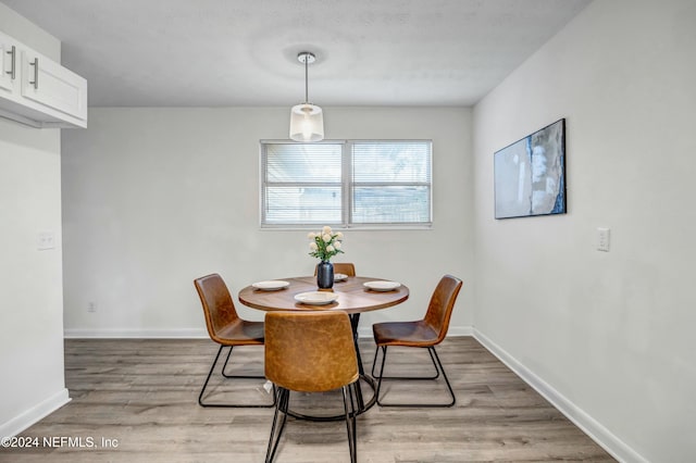 dining area with light hardwood / wood-style flooring