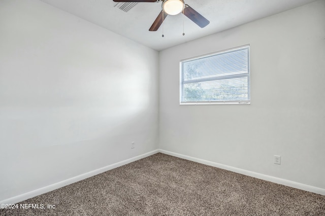 empty room with carpet and ceiling fan