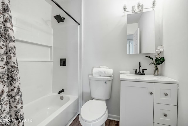 full bathroom featuring shower / bathtub combination with curtain, hardwood / wood-style floors, vanity, and toilet