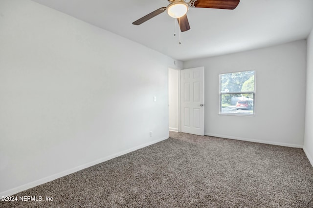 unfurnished room featuring carpet flooring and ceiling fan