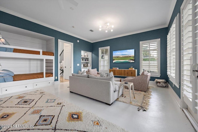 living room featuring a chandelier, concrete flooring, and ornamental molding