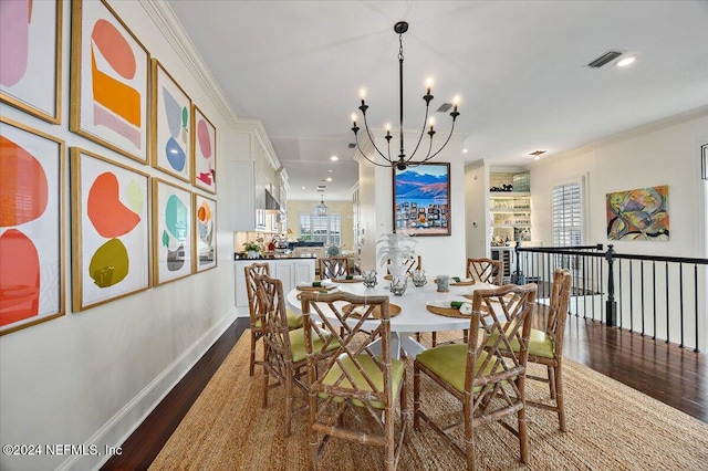 dining space with crown molding, dark hardwood / wood-style floors, and a notable chandelier