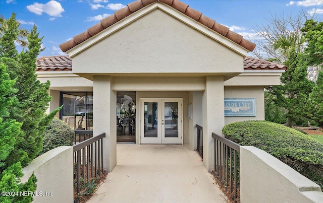 entrance to property featuring french doors