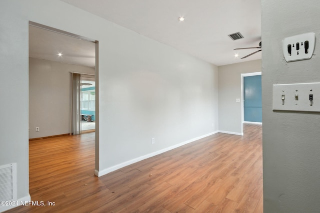 spare room with ceiling fan and light hardwood / wood-style flooring