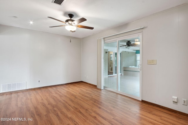 unfurnished room with light hardwood / wood-style flooring