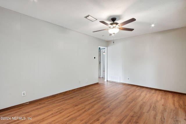 spare room featuring light hardwood / wood-style floors and ceiling fan