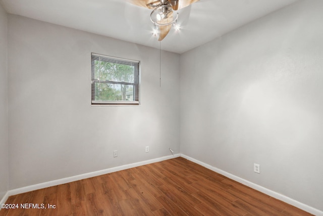 empty room with wood-type flooring