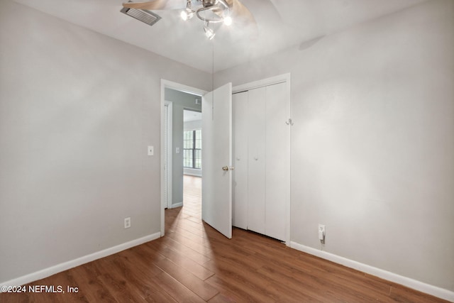 spare room with hardwood / wood-style floors