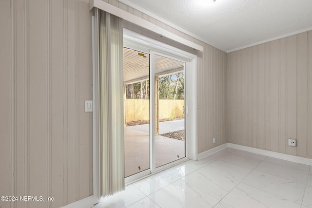 spare room featuring a textured ceiling