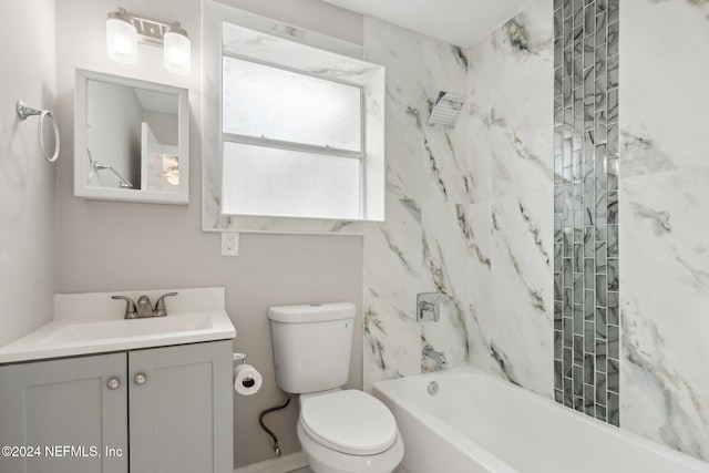 full bathroom with vanity, toilet, and tiled shower / bath combo