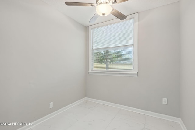 empty room featuring ceiling fan