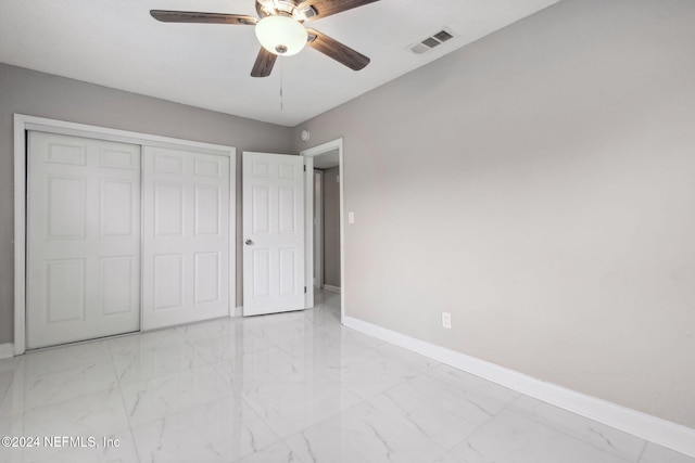 unfurnished bedroom with a closet and ceiling fan