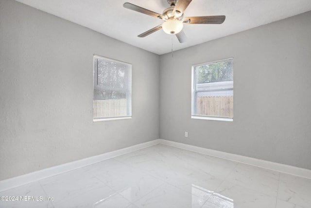 spare room featuring ceiling fan