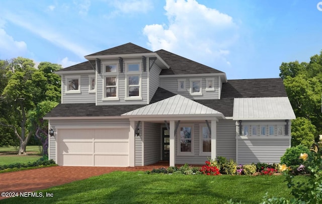 view of front of property featuring a front lawn and a garage