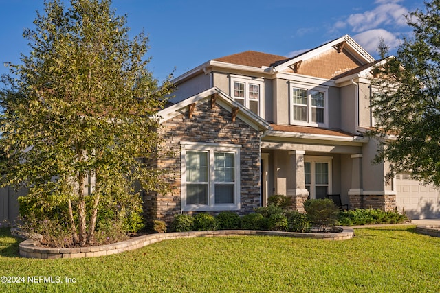 craftsman house featuring a front lawn