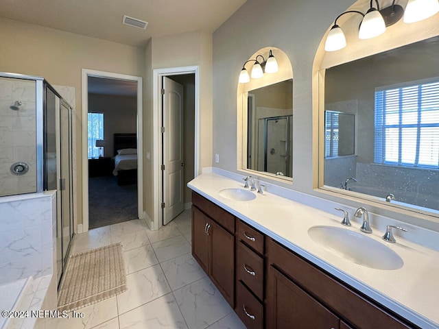 bathroom with vanity and independent shower and bath