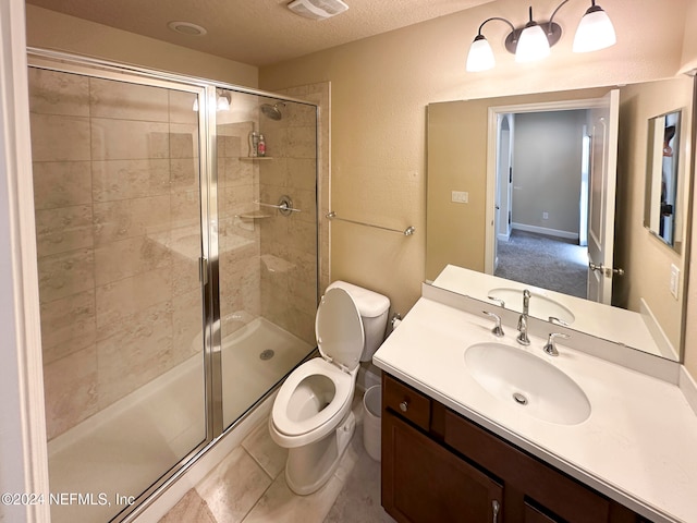 bathroom featuring walk in shower, tile patterned floors, a textured ceiling, toilet, and vanity