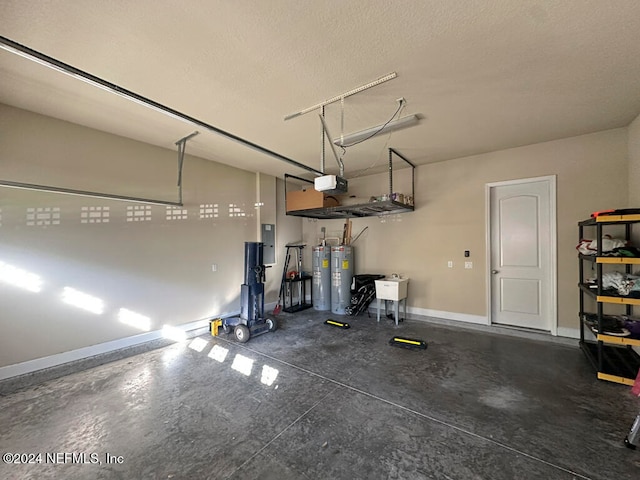 garage with electric water heater, electric panel, a garage door opener, and sink