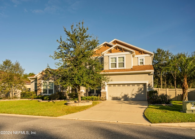 craftsman-style home with a garage and a front yard