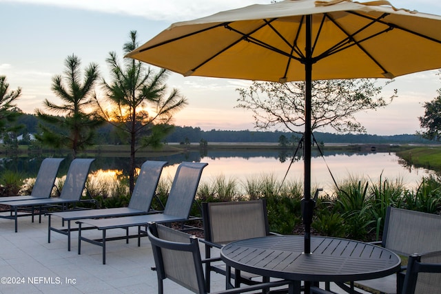 patio terrace at dusk with a water view