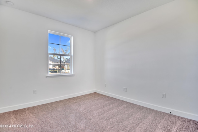 empty room with carpet flooring