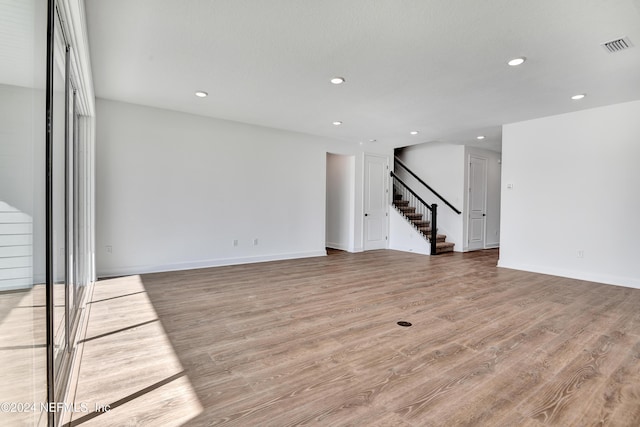 unfurnished living room with light wood-type flooring