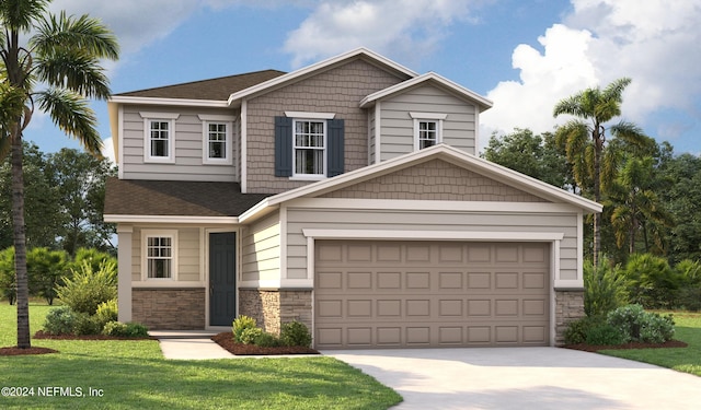 view of front of house with a front yard and a garage