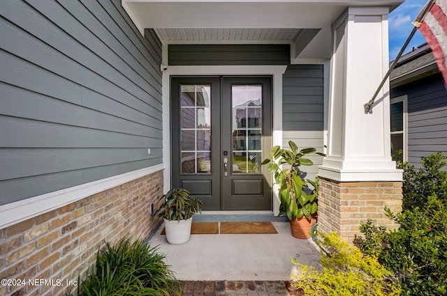 view of exterior entry featuring french doors