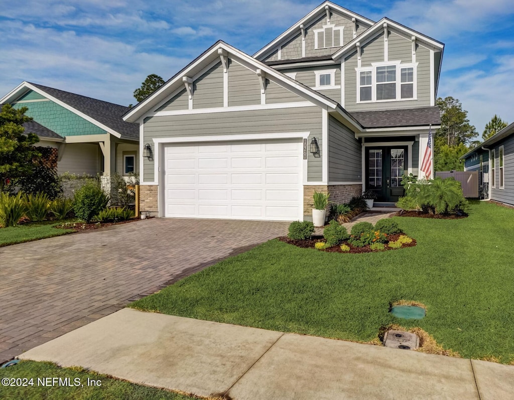 craftsman house featuring a front lawn