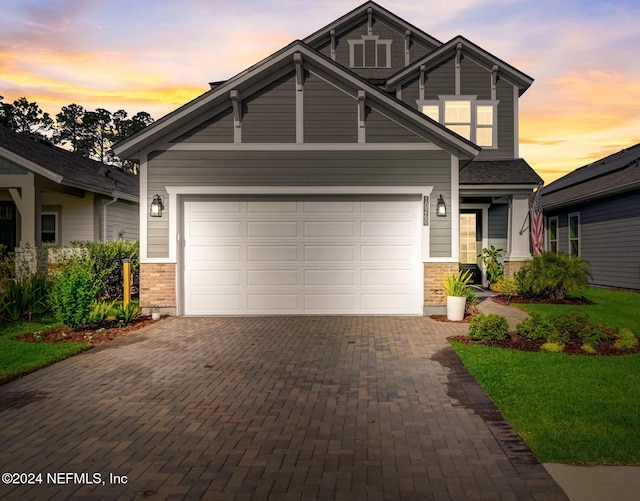 craftsman house with a garage