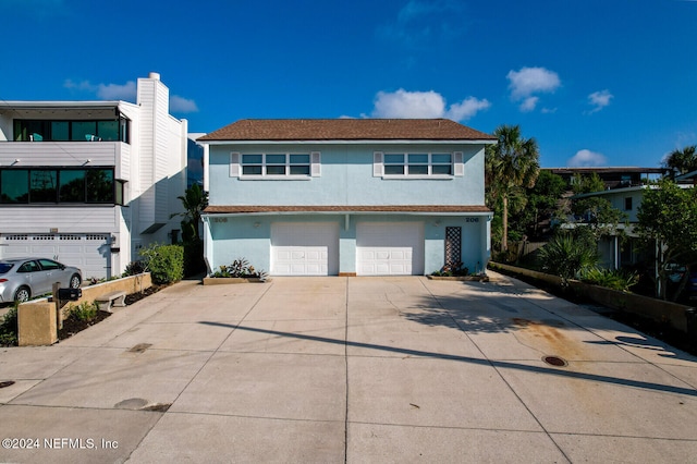 front of property with a garage