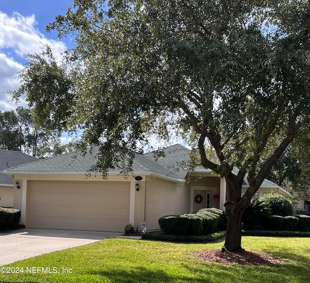 1321 Fairway Village Dr, Fleming Island, FL 32003 - view of front of home featuring a front yard and a garage