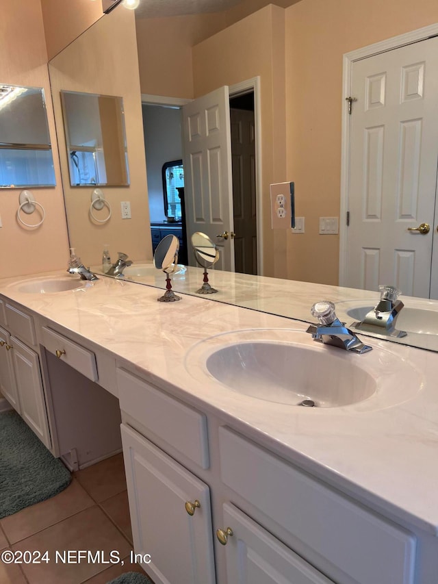 bathroom featuring tile patterned flooring and vanity