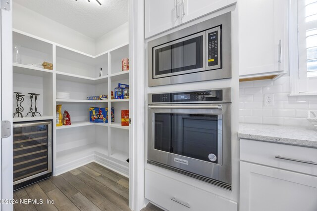 pantry featuring wine cooler