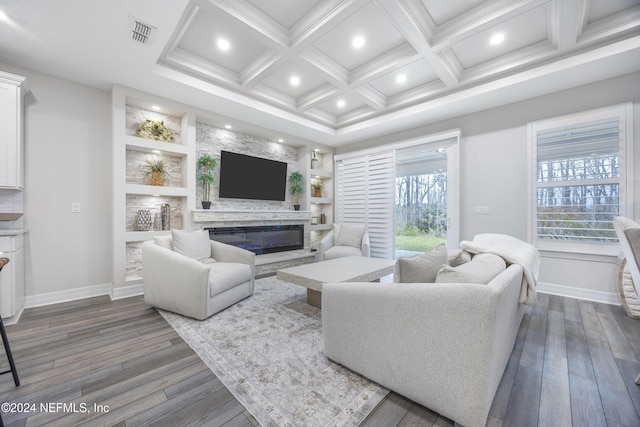 living room with beam ceiling, built in features, dark wood-type flooring, and coffered ceiling