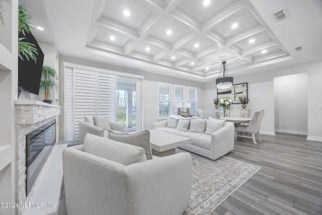 94 Hickory Pine Dr, Saint Augustine, FL 32092 - living area featuring a glass covered fireplace, baseboards, coffered ceiling, wood finished floors, and recessed lighting