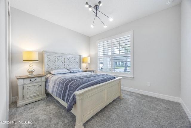 94 Hickory Pine Dr, Saint Augustine, FL 32092 - bedroom featuring light carpet, baseboards, and a chandelier
